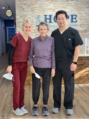 Therapist and patient smiling during clinic visit in HOPE lobby