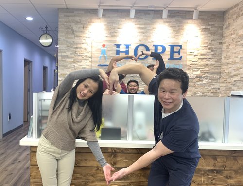 HOPE Clinic front desk team coordinating with staff member in lobby